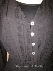 Close up V-neck black top with 4 buttons and elastic waist 