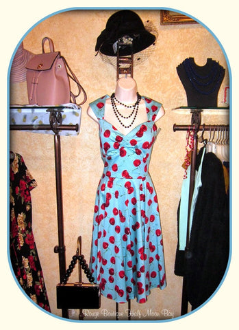 Hostess Dress in turquoise with red cherries